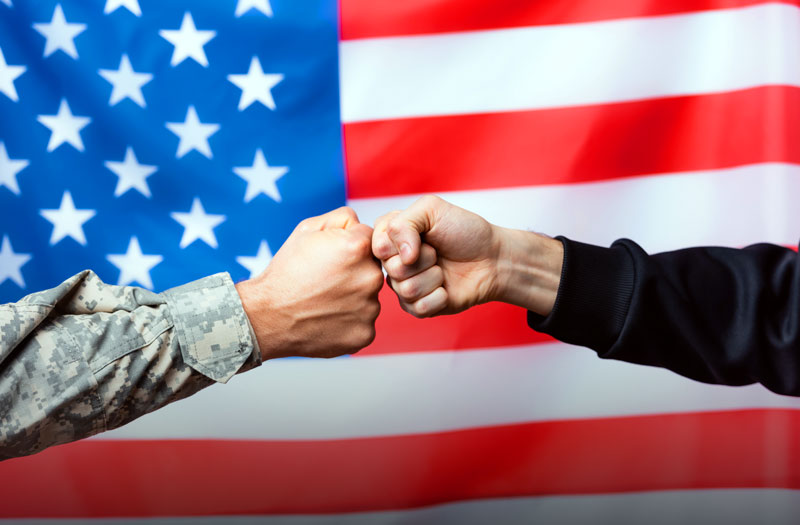 We support those who serve - handshake with American flag in background