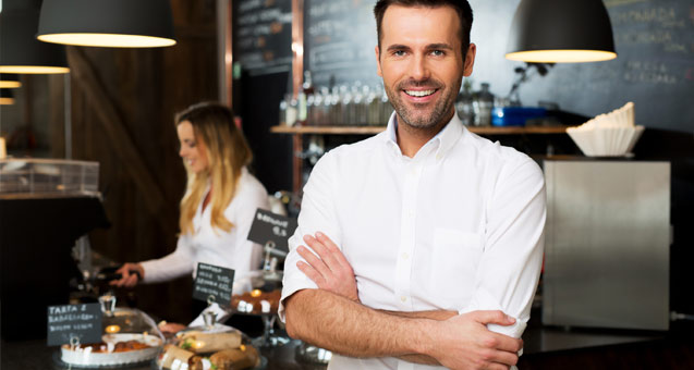 Smiling chef with arms folded across his chest
