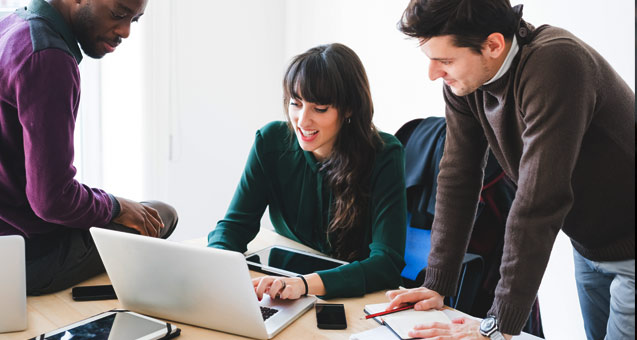 Trio of business professionals collaborating on a project about dedicated internet access.