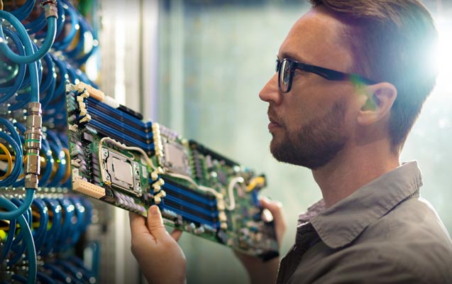 Technician working within a network rack