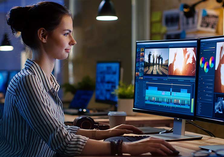 A working female professional at her computer workstation