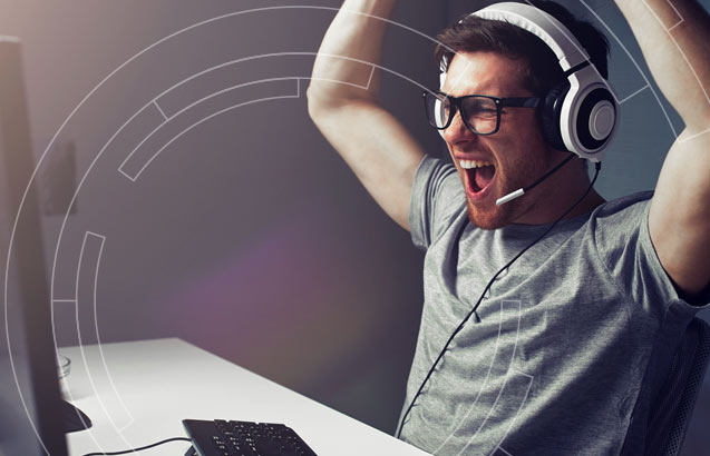 Excited gamer enjoying the benefits of InternetNow unlimited internet service.