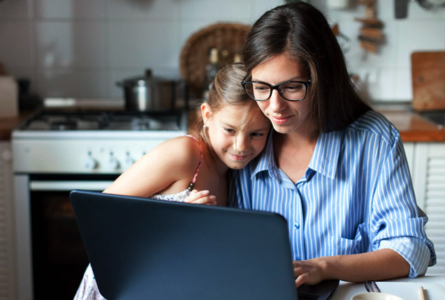Mother and daughter enjoing some Unlimited Internet online time together